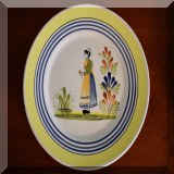 P49. Quimper plate decorated with a woman. 11” - $30 